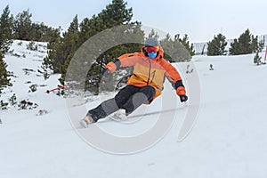 Young man skiing in the Pyrenees at the Grandvalira ski resort in Andorra in Covid19 time