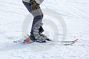 Young man on skis out of slopes, Equipment and extreme winter sports