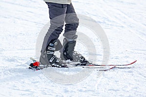 Young man on skis out of slopes, Equipment and extreme winter sports