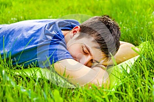 Young Man sleep on the Grass