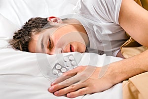 Young Man sleep with a Pills