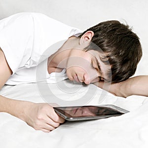 Young Man sleep with Tablet