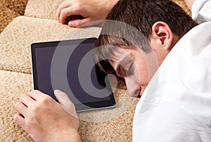 Young Man sleep with a Tablet