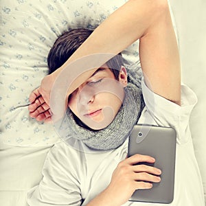 Young Man sleep with Tablet