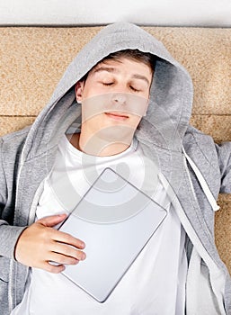 Young Man sleep with a Tablet