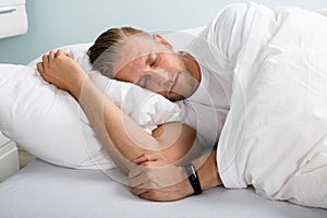 Young Man Sleeping On Bed