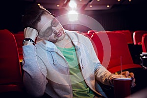 Young man sleeping in chair