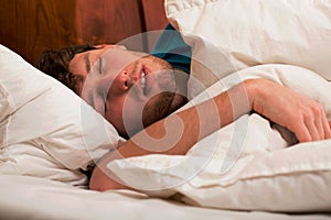 Young man sleeping photo