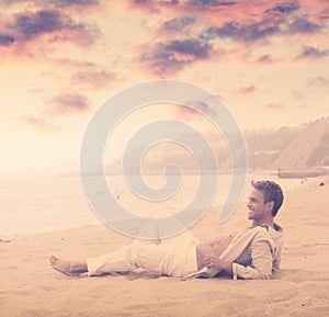 Young man smiling at beach