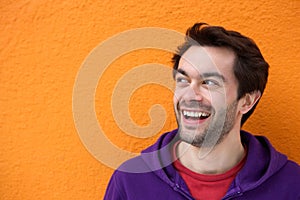 Young man smiling face looking at copy space