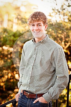 Young man smiling outside