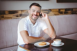 Young man smiling on the phone