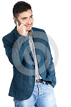 Young man smiling and talking on smart phone