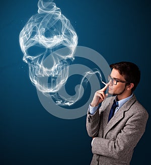 Young man smoking dangerous cigarette with toxic skull smoke