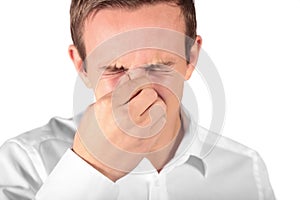 Young man sneezing