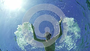 Young Man Snorkeling and Floating Through the Frame, Underwater View in Red Sea, Egypt