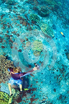 Young man in snorkelling mask dive underwater