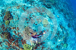 Young man in snorkelling mask dive underwater
