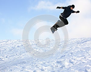 Young man on snowboard