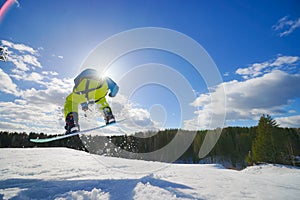 Young man on the snowboard