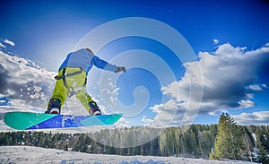 Young man on the snowboard