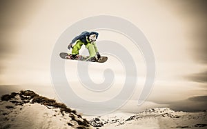 Young man snowboarder