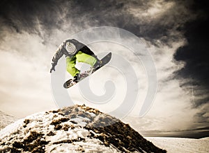 Young man snowboarder