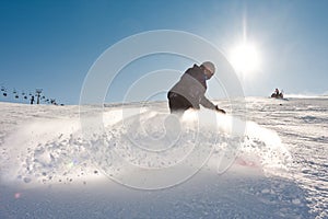 Young man snowboarding