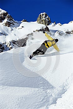 Young man snowboarding