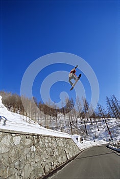 Young man snowboarding