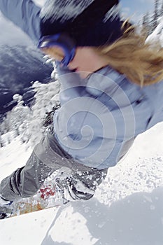 Young man snowboarding