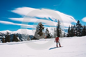 Young man snowboarding in the Austrian Alps