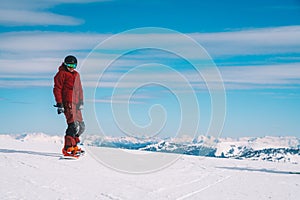 Young man snowboarding in the Austrian Alps