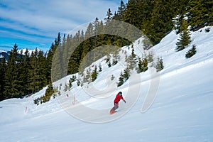 Young man snowboarding in the Austrian Alps, making different tricks