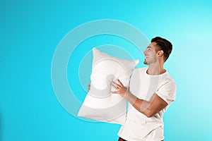 Young man with soft pillow