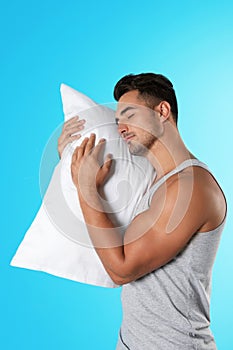 Young man with soft pillow