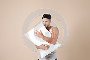 Young man with soft pillow