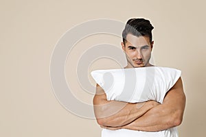 Young man with soft pillow