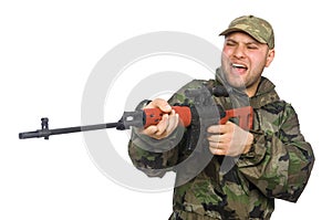 Young man in soldier uniform holding gun