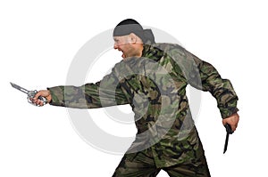 Young man in soldier uniform holding knife