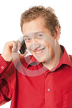 Young man speaks by a mobile phone