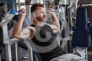 Young man in sport gym club