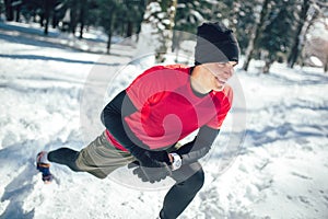 Young man in sporty wear alone doing exercise before running