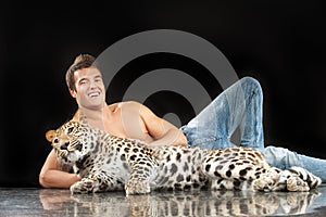 Young man and spotty leopard