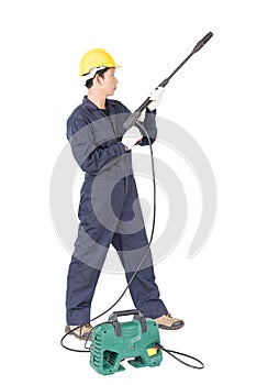Young man stand and holding high pressure water gun