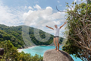 Young man stand on viewpoint sailing rock ilan ison Simland, Similan No.8 at Similan national park, Phuket, Thailand