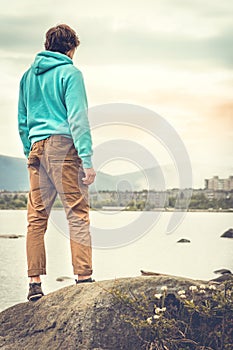 Young Man standing alone outdoor Travel Lifestyle