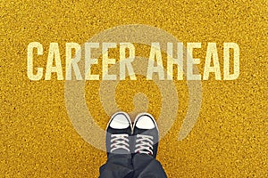 Young man standing at Career Ahead sign