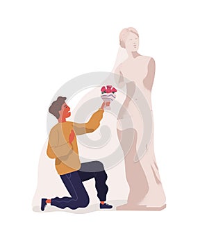 Young man standing on one knee and presenting bouquet of flowers to statue of woman. Concept of idealization of partner