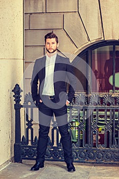 Young man standing outside office building in New York City